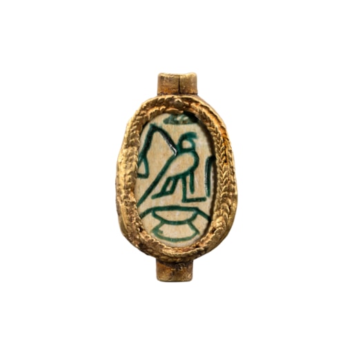 A Hyksos Scarab with gold mounting.